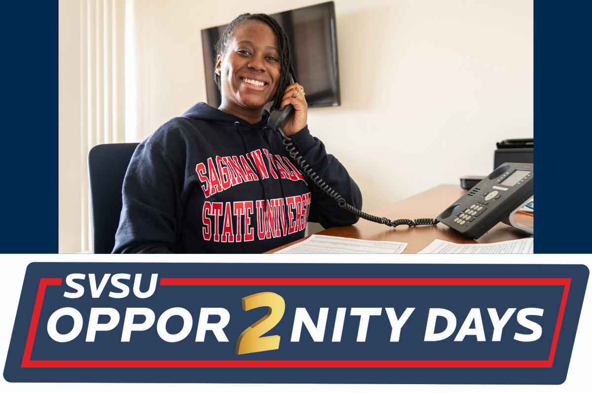 Young woman looking at camera with phone to ear